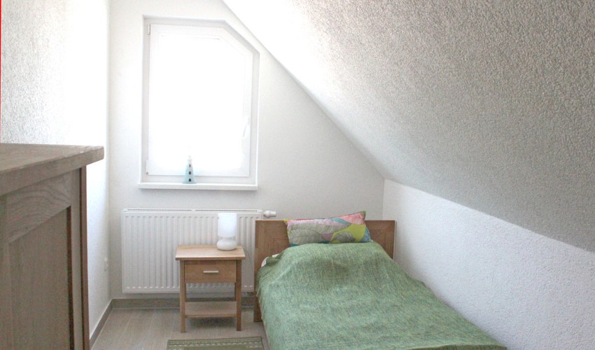Schlafzimmer mit Einzelbetten im OG