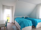 Schlafzimmer mit Einzelbetten im OG