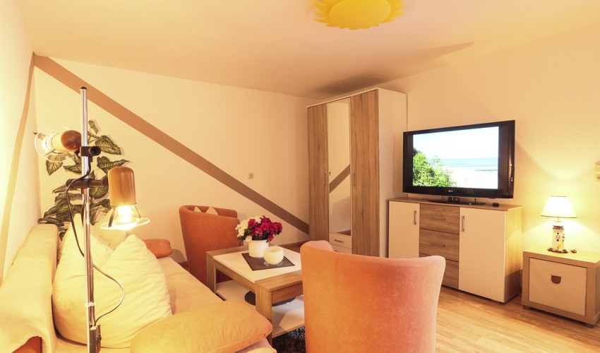 Wohnbereich mit Treppenaufgang