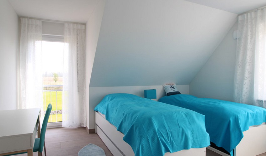 Schlafzimmer mit Einzelbetten im OG